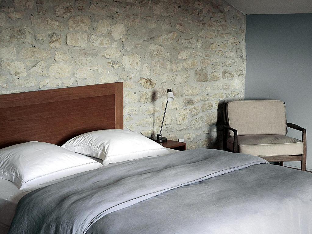 Postel nebo postele na pokoji v ubytování La Bastide