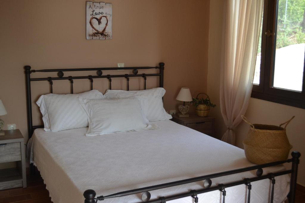 Postel nebo postele na pokoji v ubytování Evia Family House