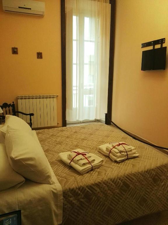 Postel nebo postele na pokoji v ubytování Domus Cicerone