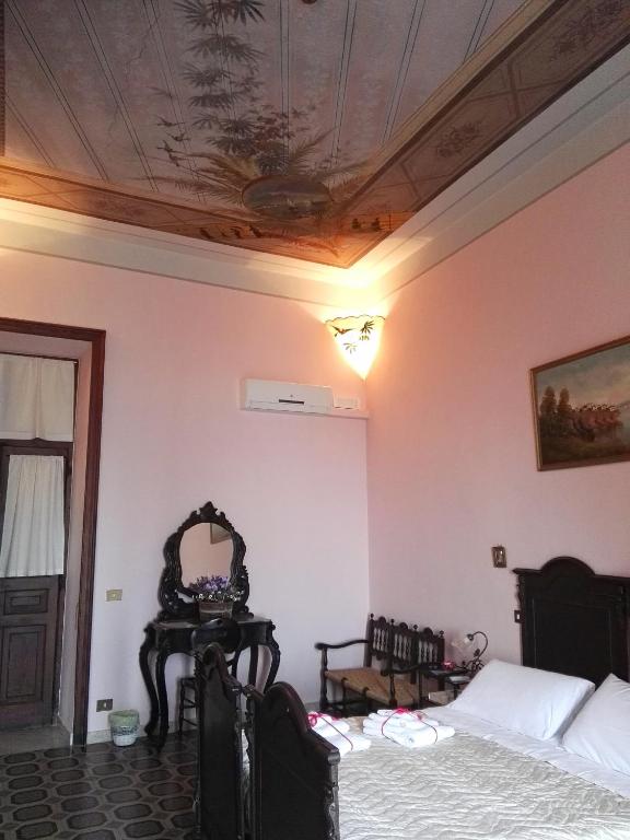 Postel nebo postele na pokoji v ubytování Domus Cicerone