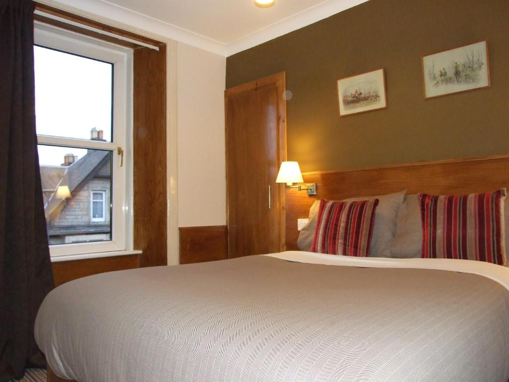 Postel nebo postele na pokoji v ubytování Leith House