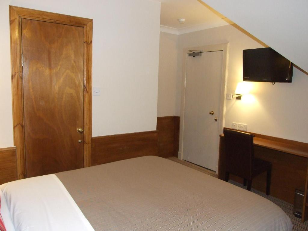 Postel nebo postele na pokoji v ubytování Leith House