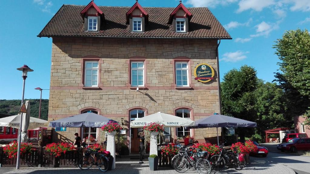 a building with bikes parked in front of it at FeWos im alten Bahnhof in Lauterecken