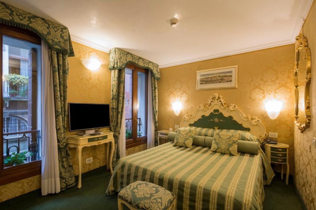 Postel nebo postele na pokoji v ubytování Hotel Becher