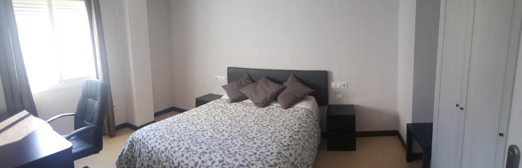 Posteľ alebo postele v izbe v ubytovaní Apartamento Comedias