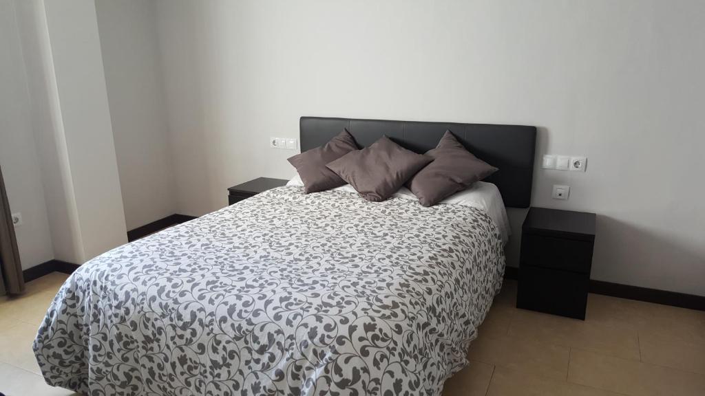 Posteľ alebo postele v izbe v ubytovaní Apartamento Comedias