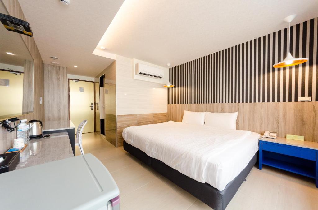 Postel nebo postele na pokoji v ubytování P&E Hotel