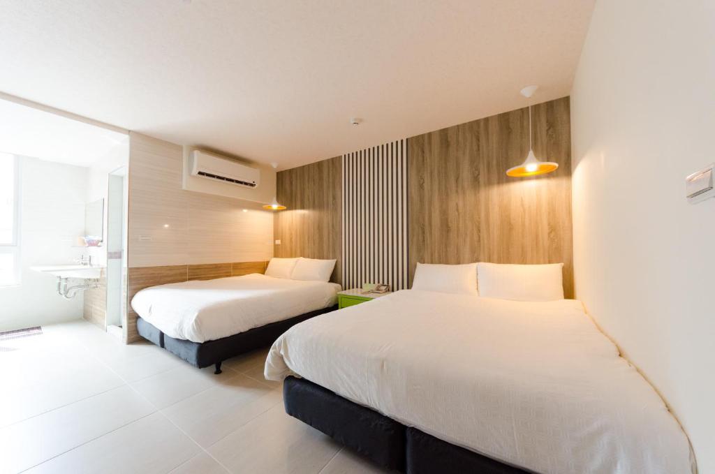Postel nebo postele na pokoji v ubytování P&E Hotel