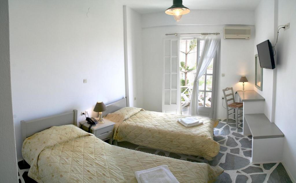Postel nebo postele na pokoji v ubytování Vidalis Hotel