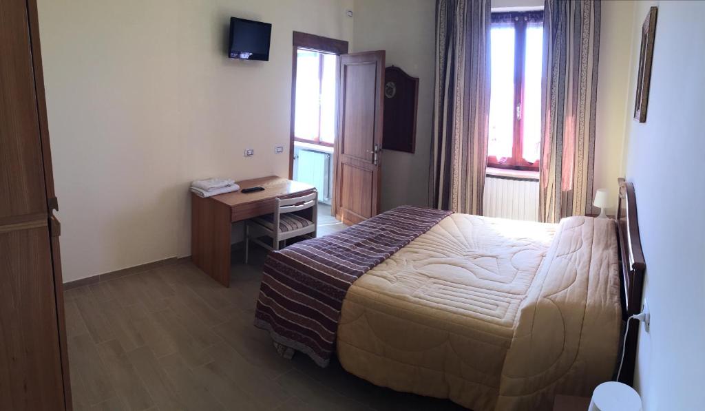 Postel nebo postele na pokoji v ubytování B&B Le Stagioni