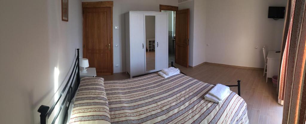 Postel nebo postele na pokoji v ubytování B&B Le Stagioni