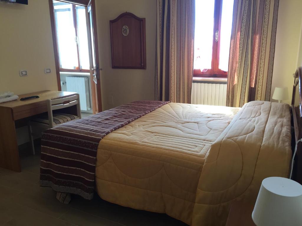 Postel nebo postele na pokoji v ubytování B&B Le Stagioni