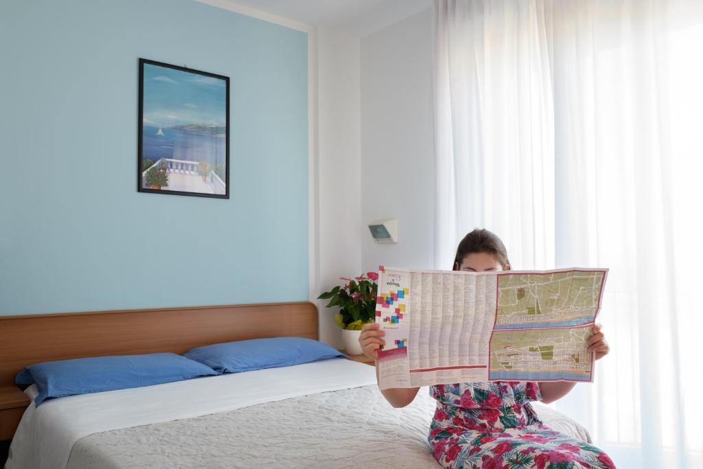 Postel nebo postele na pokoji v ubytování Hotel Emilia