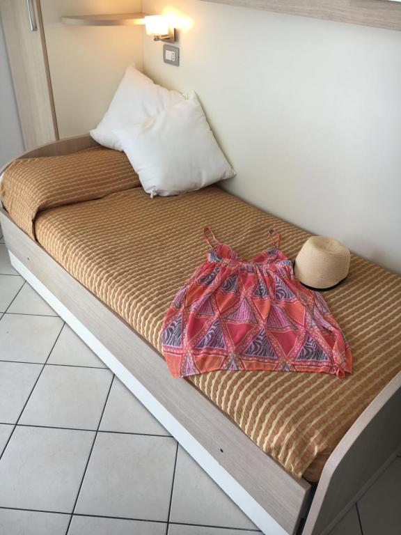 A bed or beds in a room at Residence Il Tulipano