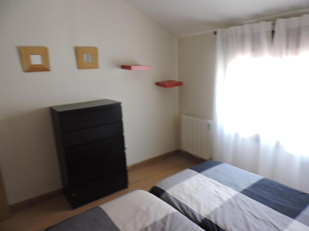 Posteľ alebo postele v izbe v ubytovaní Apartamento El Rasero