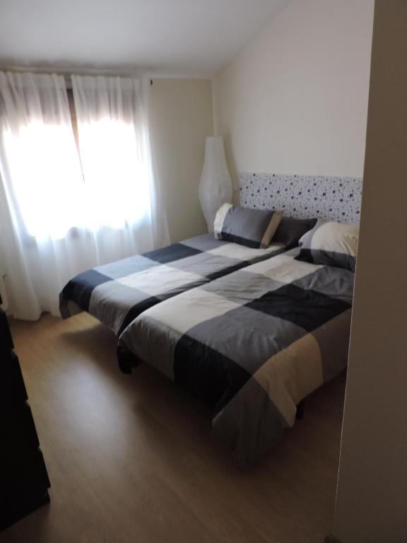 Posteľ alebo postele v izbe v ubytovaní Apartamento El Rasero