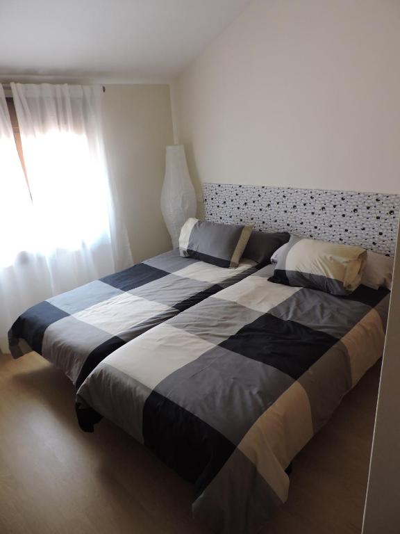Posteľ alebo postele v izbe v ubytovaní Apartamento El Rasero