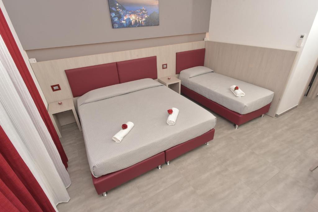 Postel nebo postele na pokoji v ubytování Eden Rooms