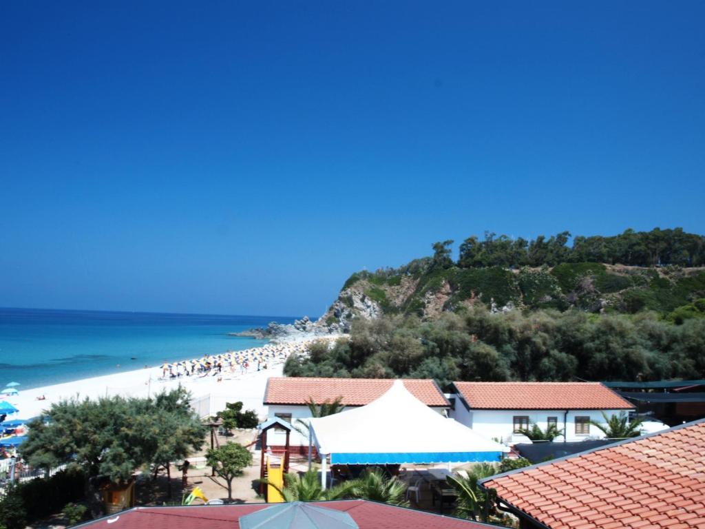 a view of the beach from a resort at Residence Il Turistico in Zambrone