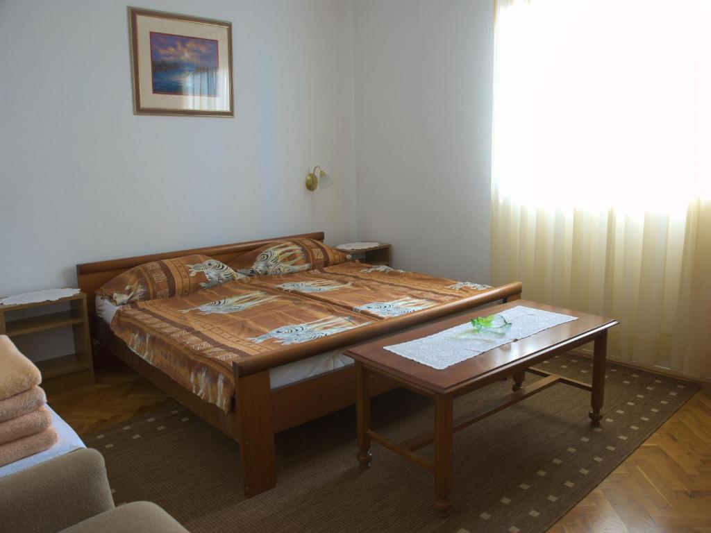 Postel nebo postele na pokoji v ubytování Nada Apartments