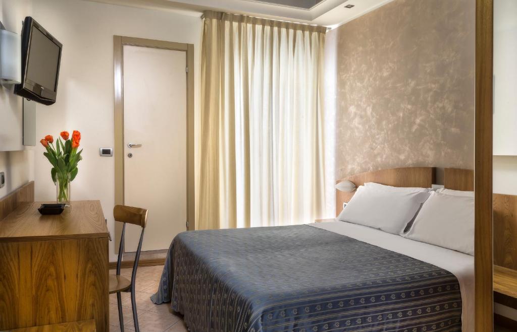 Postel nebo postele na pokoji v ubytování ACasaMia WelcHome Hotel