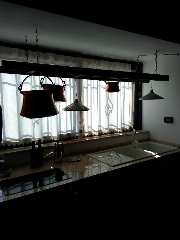 A kitchen or kitchenette at Trulli Sarmenzanello