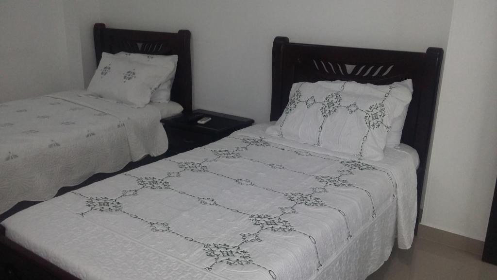 Postel nebo postele na pokoji v ubytování Hotel La Vieja Sara