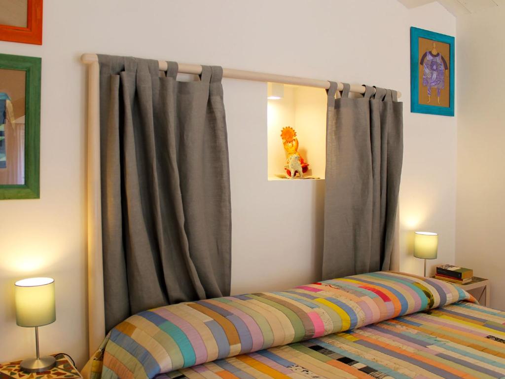 Postel nebo postele na pokoji v ubytování Il Sasso e la Seta