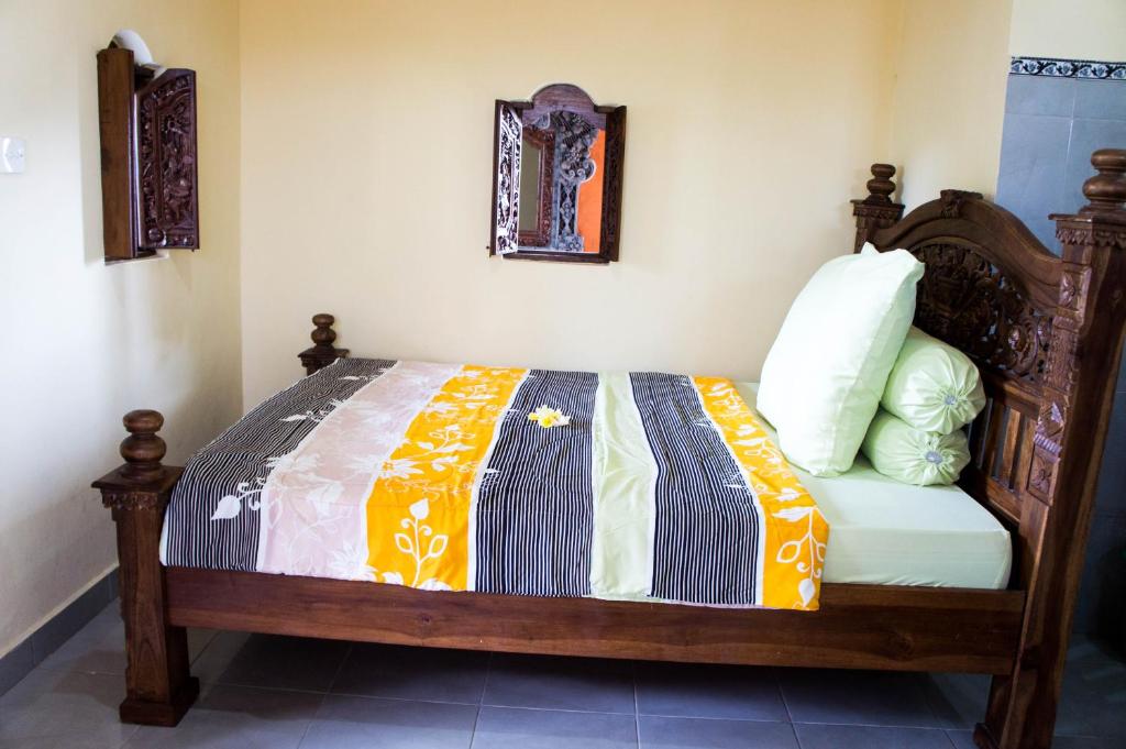 Postel nebo postele na pokoji v ubytování Shiva House
