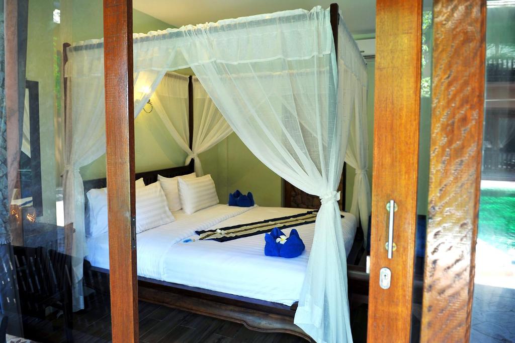 Postel nebo postele na pokoji v ubytování Koh Tao Beach Club