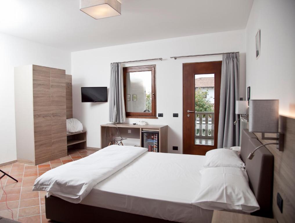 Postel nebo postele na pokoji v ubytování Albergo Grobberio