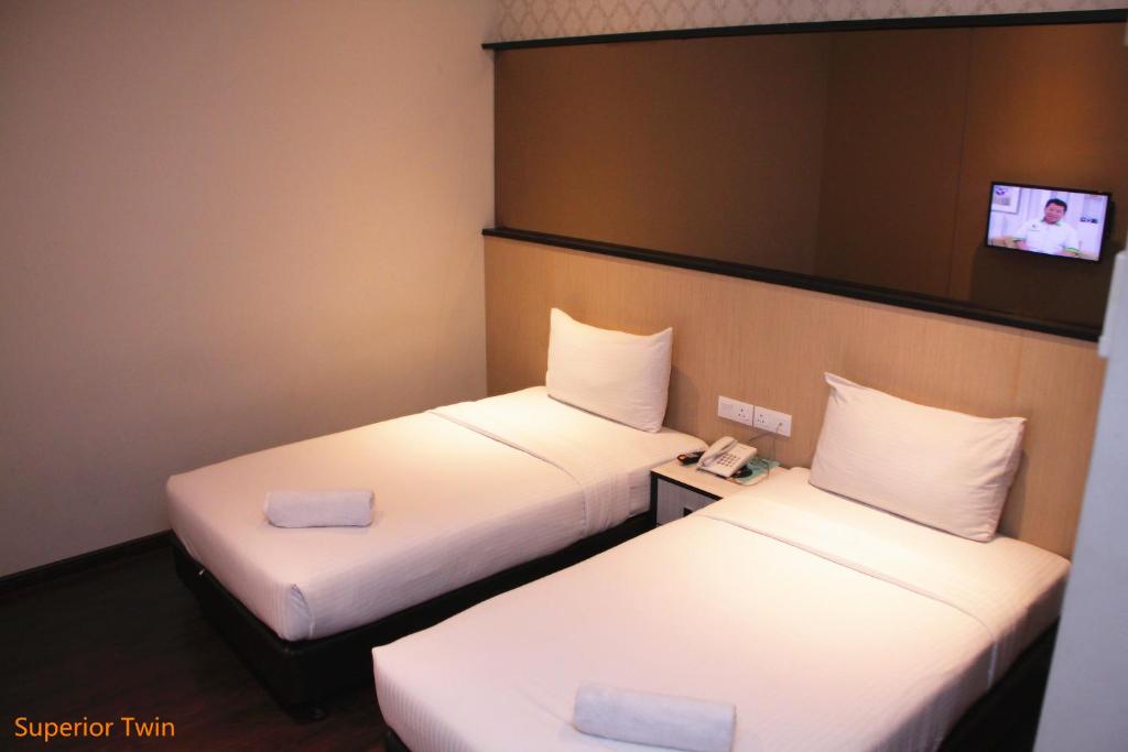 Postel nebo postele na pokoji v ubytování D Elegance Hotel