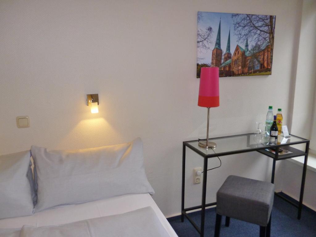 Postel nebo postele na pokoji v ubytování Hotel Am Mühlenteich