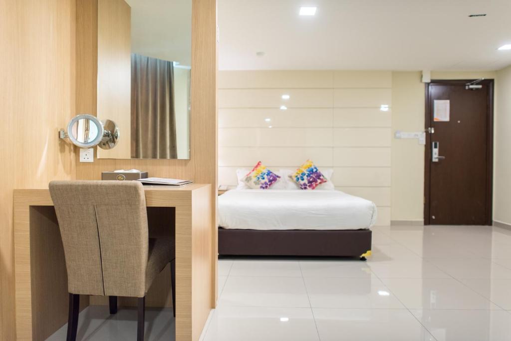 Katil atau katil-katil dalam bilik di Mornington Hotel Sitiawan