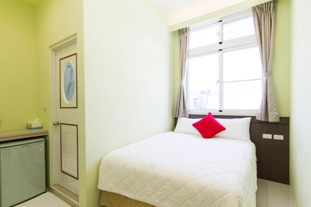 Postel nebo postele na pokoji v ubytování Mu Yu B&B