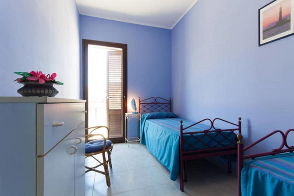 Łóżko lub łóżka w pokoju w obiekcie Seaside Apartment