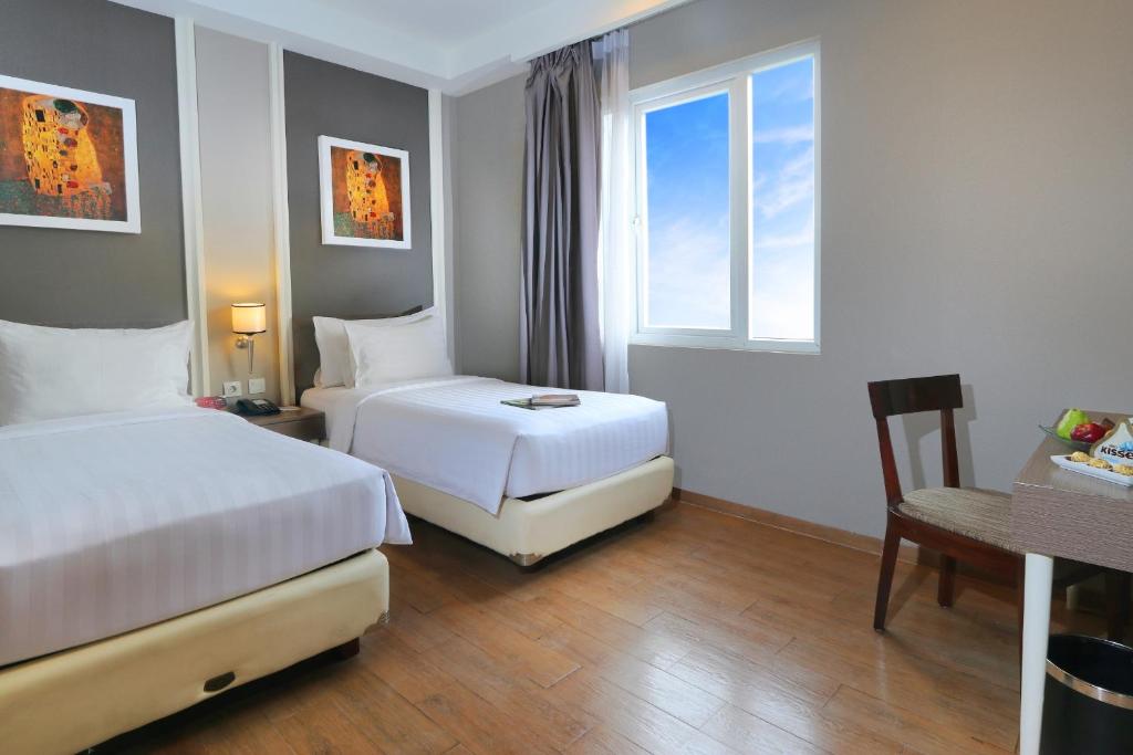Rúm í herbergi á Pranaya Boutique Hotel