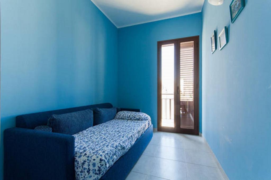 Łóżko lub łóżka w pokoju w obiekcie Seaside Apartment