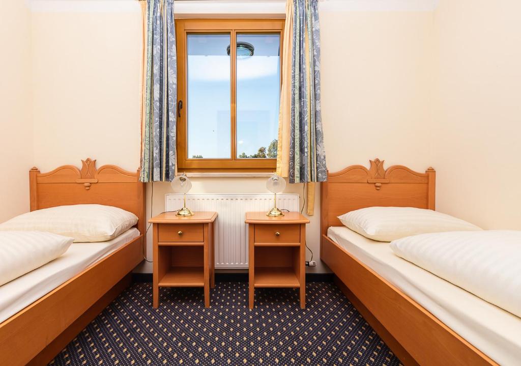 Postel nebo postele na pokoji v ubytování Hotel Fasching