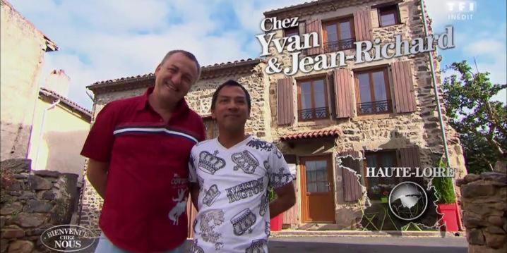 two men are standing in front of a building at Le Relais in Lavoûte-Chilhac