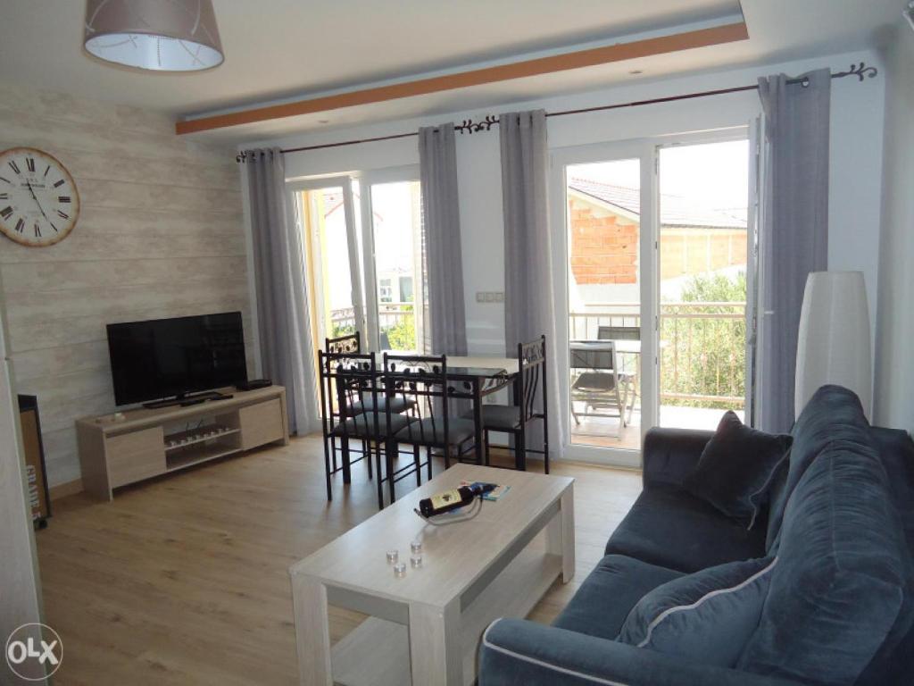 Televízia a/alebo spoločenská miestnosť v ubytovaní I.K. APARTMENTS