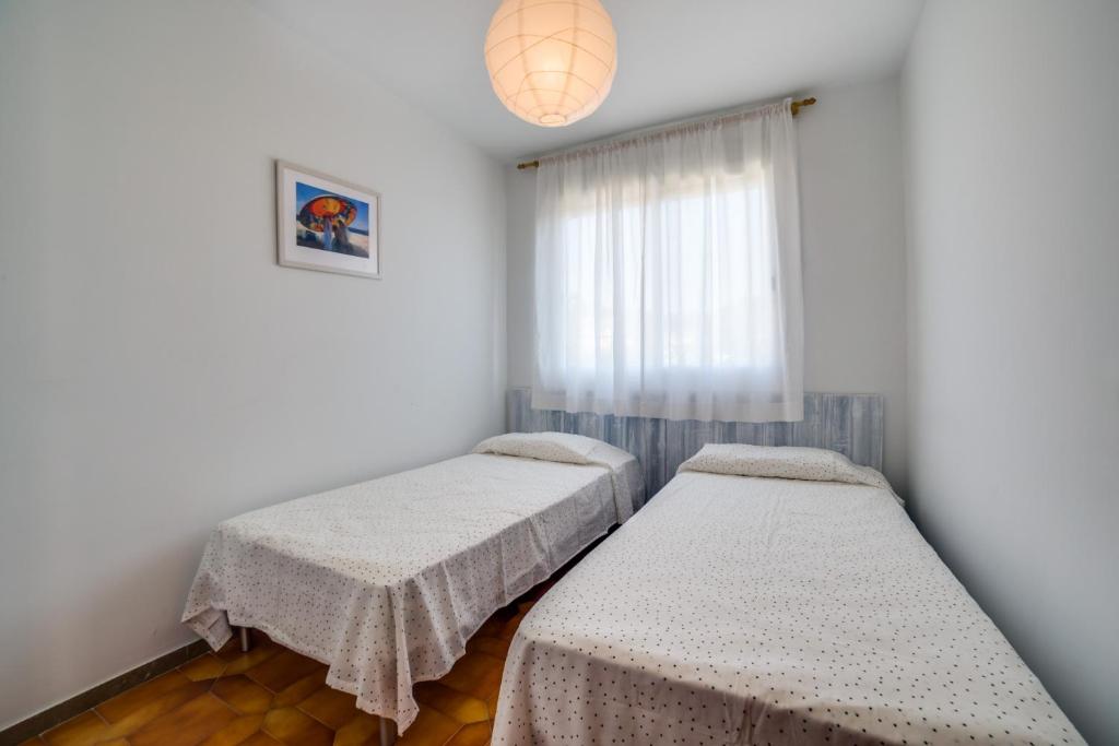Postel nebo postele na pokoji v ubytování Vivalidays Casa Genis