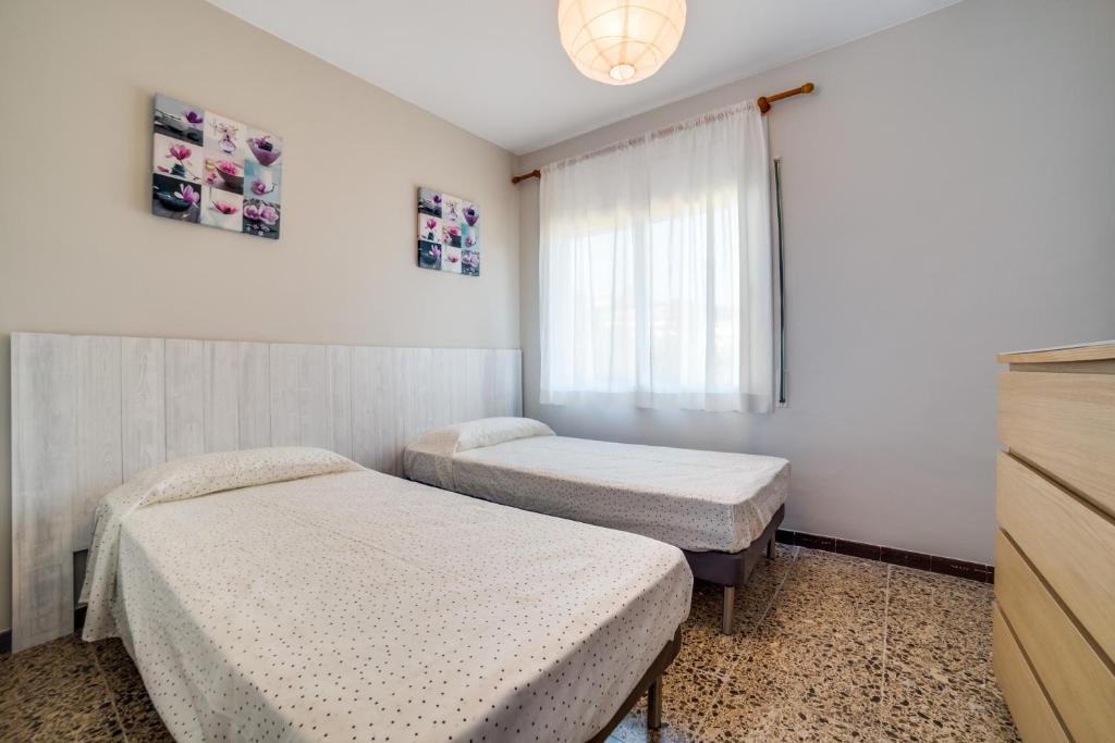 Postel nebo postele na pokoji v ubytování Vivalidays Casa Genis