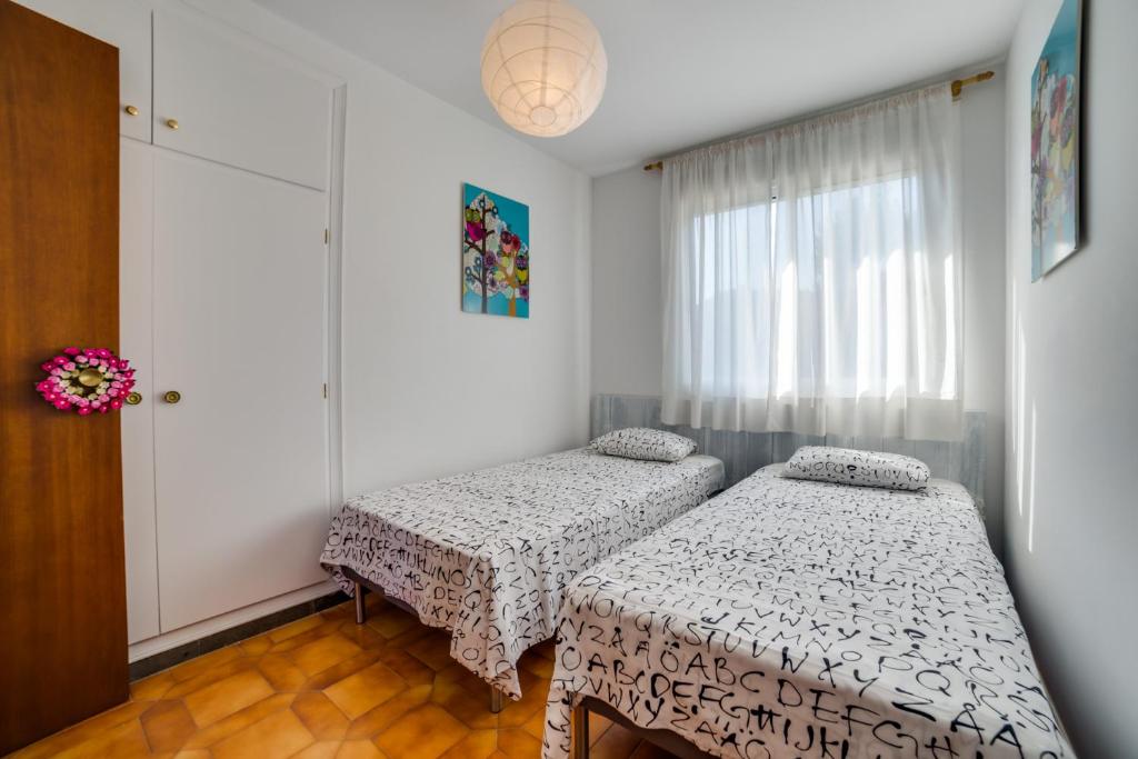 Postel nebo postele na pokoji v ubytování Vivalidays Casa Genis