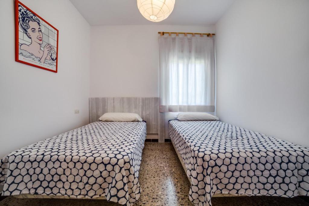 Postel nebo postele na pokoji v ubytování Vivalidays Casa Genis