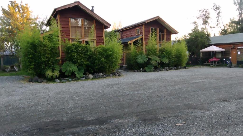 a house with a driveway in front of it at Turismo Montaña in Ensenada