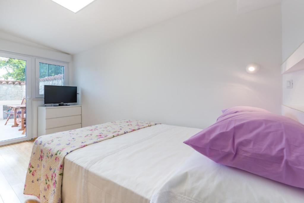 Posteľ alebo postele v izbe v ubytovaní Apartment Ortensia Dubrovnik Colors