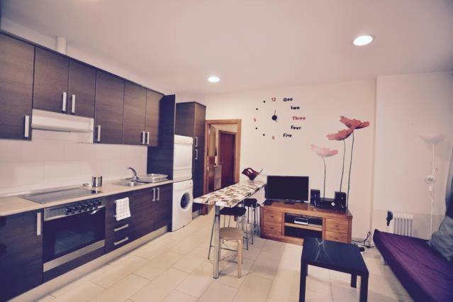 a kitchen with a sink and a counter top at Apartment Downtown Sabadell in Sabadell