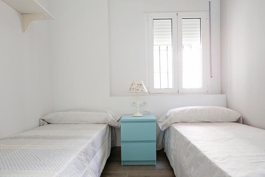 Posteľ alebo postele v izbe v ubytovaní Hello Málaga Flat Victoria