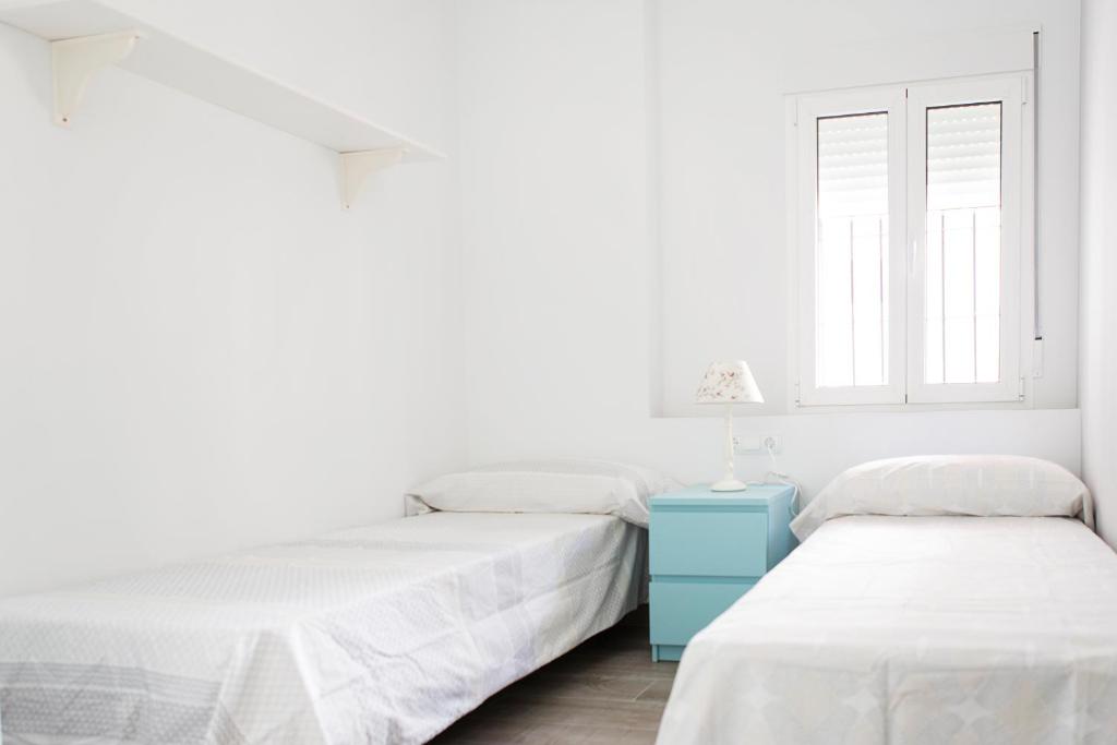 Posteľ alebo postele v izbe v ubytovaní Hello Málaga Flat Victoria